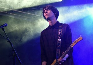 Guitarist with the band Gengahr on stage with blue and white lighting